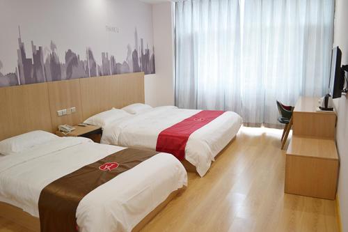 Katil atau katil-katil dalam bilik di Thank Inn Chain Hotel Zhangjiakou Zhangbei County Tianbao New City