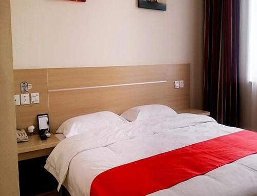 Postelja oz. postelje v sobi nastanitve Thank Inn Chain Hotel Hebei Langfang Dacheng County Kuoda Road