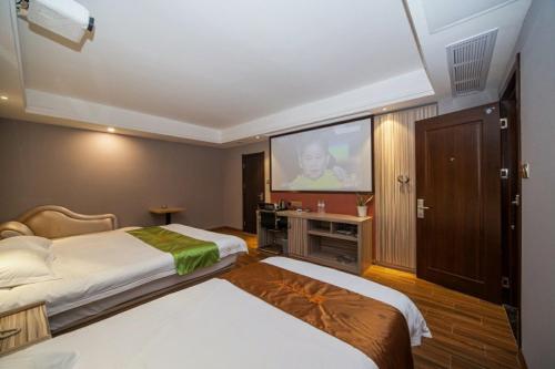 Postel nebo postele na pokoji v ubytování JUNYI Hotel Jiangsu Yancheng Tinghu District Jinying International Shopping Center