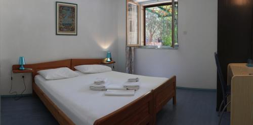 Postel nebo postele na pokoji v ubytování SD House Rooms
