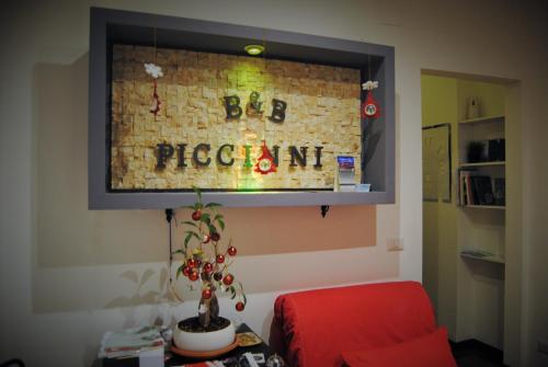 a living room with a sign on a brick wall at B&B Piccinni 191 in Bari
