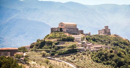 a town on top of a hill with a castle at La Vista del Taburno in Montesarchio