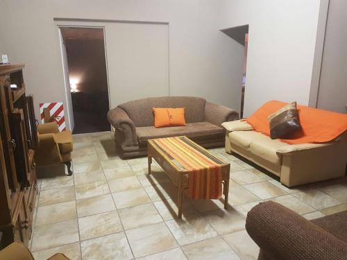 a living room with two couches and a table at The Highland Inn in Bethlehem