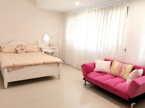 Katil atau katil-katil dalam bilik di Country Style Anping Homestay
