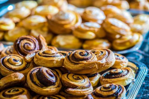 a pile of pastries sitting on top of a table at Hotel Kapitany Wellness in Sümeg