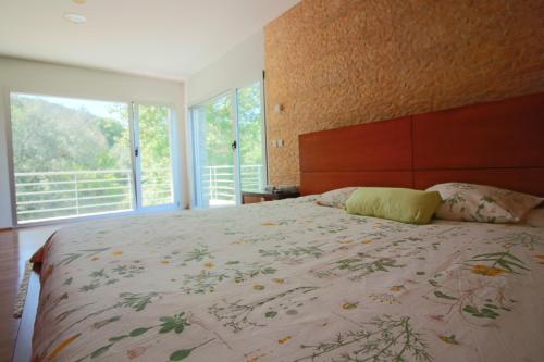 מיטה או מיטות בחדר ב-Casa de Paredes Secas