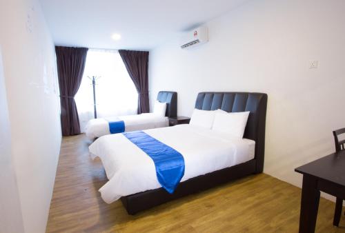 Ένα ή περισσότερα κρεβάτια σε δωμάτιο στο Hard Rock VIP Guest House