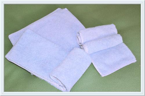 a pair of white towels on a green surface at Chesa Tre Piz, Maloja in Maloja