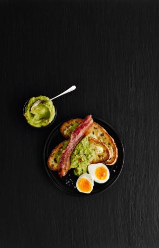 a plate of eggs and bacon and toast with avocado at ibis Hull City Centre in Hull