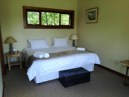 Ein Bett oder Betten in einem Zimmer der Unterkunft Sani Window B&B and Self catering