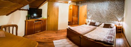 Una cama o camas en una habitación de Penzión Gitka
