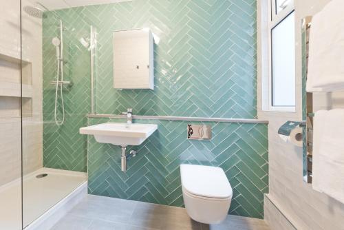 a bathroom with a sink and a toilet at Temple Bar Crown Square Apartments in Dublin