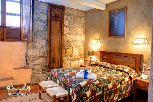 Cama o camas de una habitación en Hotel Casa del Anticuario
