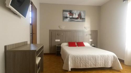 Кровать или кровати в номере La Maison Du Belvedere