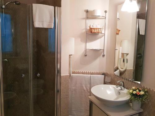 a bathroom with a sink and a shower at Hotel Nappo in San Marzano sul Sarno