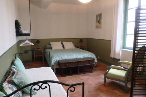 מיטה או מיטות בחדר ב-gîte de la Domergue