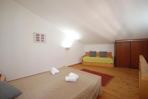 En eller flere senge i et værelse på Quinta Rosa Branca