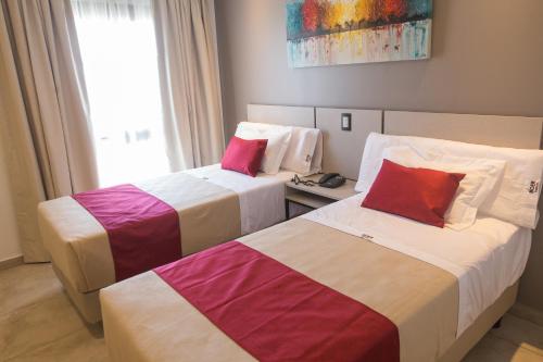 Postel nebo postele na pokoji v ubytování Boer Hotel By Kube