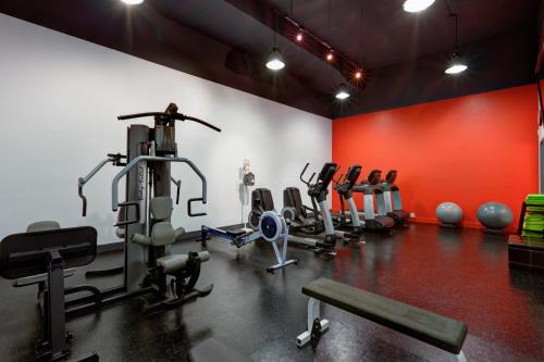 a gym with several tread machines in a room at Radisson Blu Toronto Downtown in Toronto