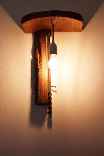 a light on a wall next to a window at Le Checche in Pienza
