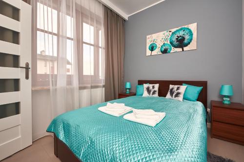 Postel nebo postele na pokoji v ubytování Apartament Zdrojowy