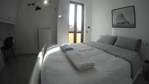 Кровать или кровати в номере GoodStay Casa Tati