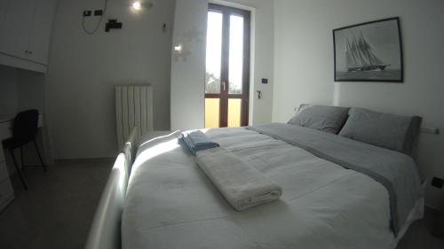 Posteľ alebo postele v izbe v ubytovaní GoodStay Casa Tati