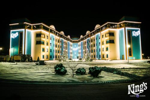 a large building is lit up at night at King's Resort - casino and hotels in Rozvadov