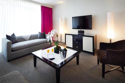a living room with a couch and a coffee table at Royalton Park Avenue in New York