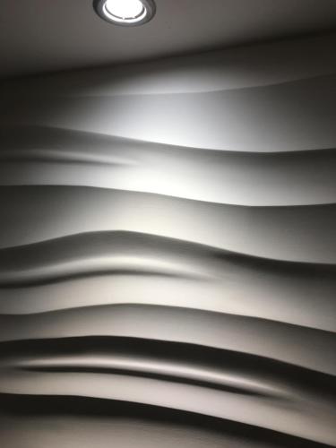 a black and white photo of a ceiling with a light at OurHaus in Beverley