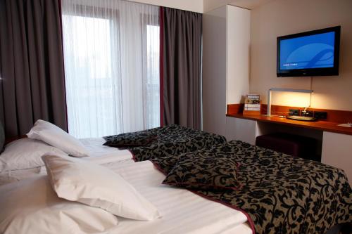 Tempat tidur dalam kamar di Break Sokos Hotel Vuokatti