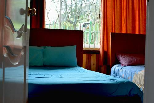 Katil atau katil-katil dalam bilik di Hostal Mirador de Otavalo