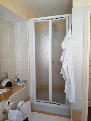 a shower with a glass door in a bathroom at casa del cirillo in Ornica