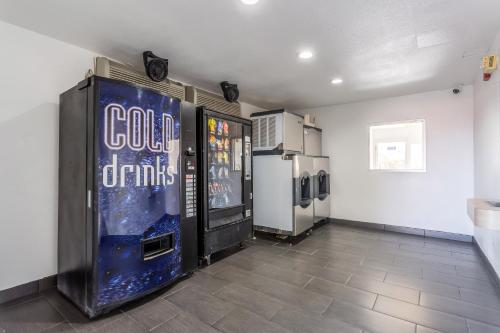 a room with two vending machines and a video game at Motel 6-Needles, CA in Needles