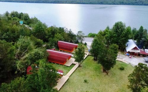 an overhead view of a building next to a lake at Eco Cabañas Wanderlust in Puerto Puyuhuapi