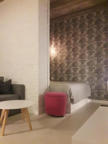 a living room with a couch and a table at Momo Apartment in Belgrade