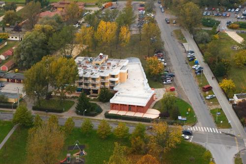 an aerial view of a building in a city at Csipke Hotel in Kiskunhalas