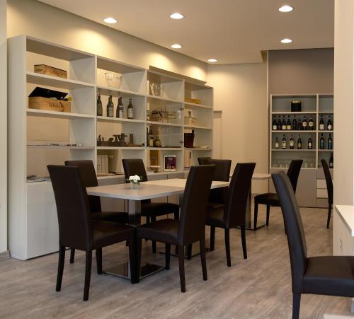 a dining room with a table and chairs at Albergo Sole in Mariano Comense
