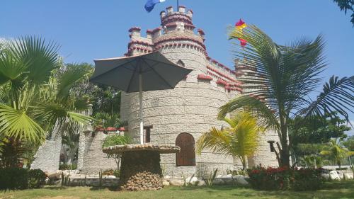 a castle with an umbrella in front of it at Eco-Hotel Villa Elina in Ríohacha
