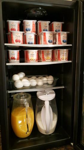 a refrigerator filled with lots of food and drinks at Port Angeles Inn in Port Angeles