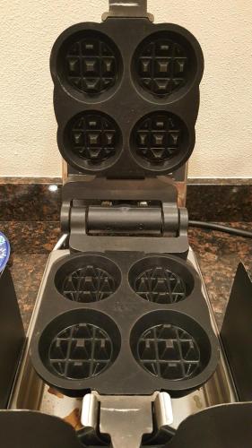 a stove top with many knobs on top of it at Port Angeles Inn in Port Angeles