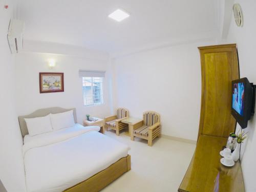 Giường trong phòng chung tại Phan Anh Hotel - Bui Vien Walking Street