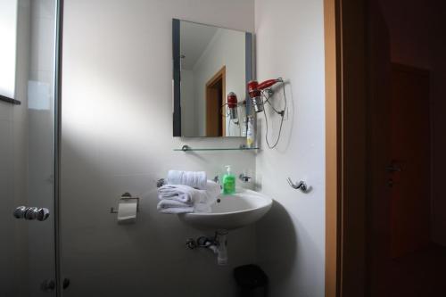 a bathroom with a sink and a mirror at Apartment Dalmatien Traumhaus in Makarska