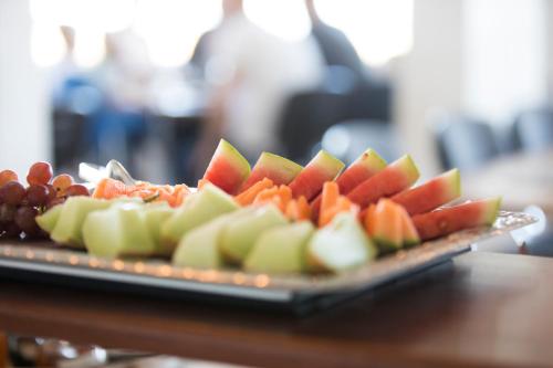 a tray of sliced fruits and vegetables on a table at B&B by the Sea Hirtshals in Hirtshals
