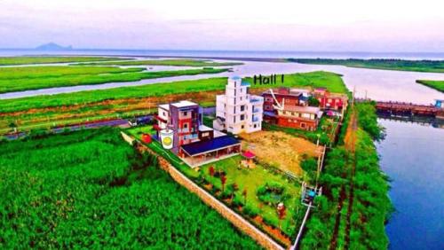 a building on an island in a body of water at Lanyang Beach Villa in Wujie