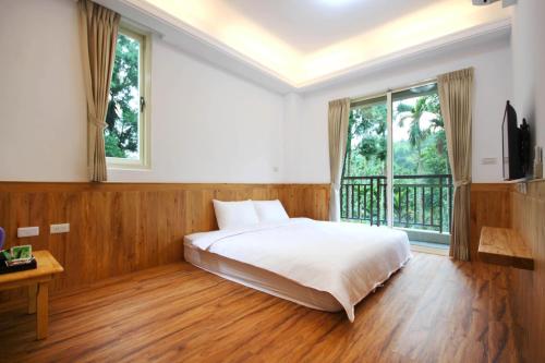 מיטה או מיטות בחדר ב-Ban Tian Tao Fang