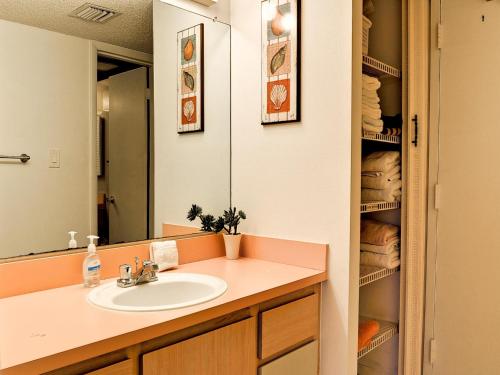 a bathroom with a sink and a mirror at 440 West Condos 408N in Clearwater Beach