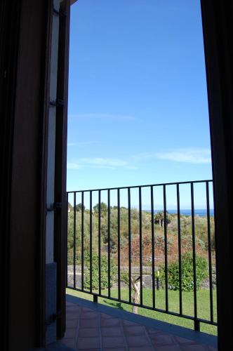 a room with a view of the ocean from a balcony at Case Vacanze Residence Trinacria in Acireale