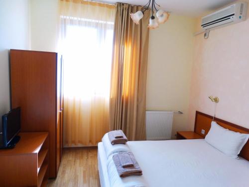 Кровать или кровати в номере Guest House Misha