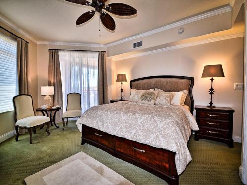 a bedroom with a bed and a ceiling fan at Belle Harbor 402W in Clearwater Beach